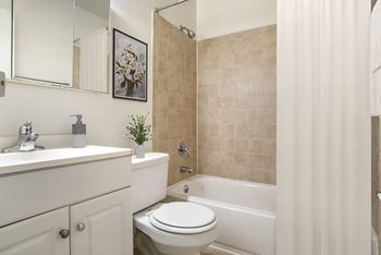 A bathroom with white toilet
